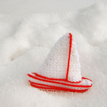 photo of two tone ship decoration in the snow