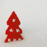 photo of tree decoration in snow