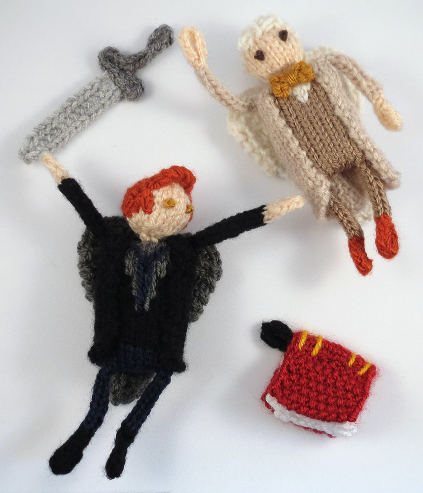 two knitted angels on a white background