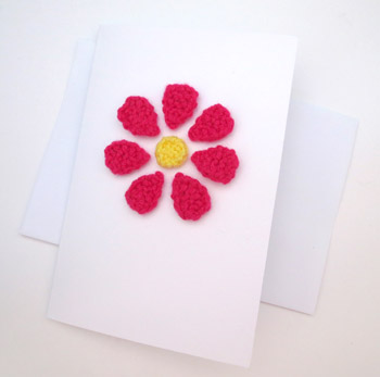 Card with knitted flower on it